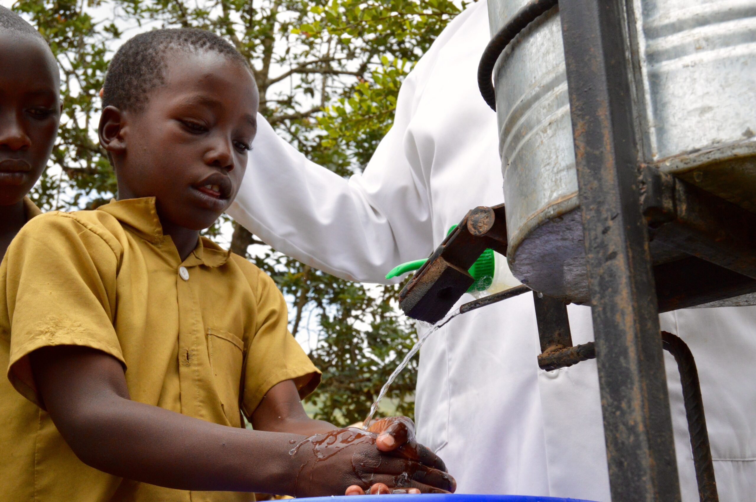 Boy washing his hands in Rwanda