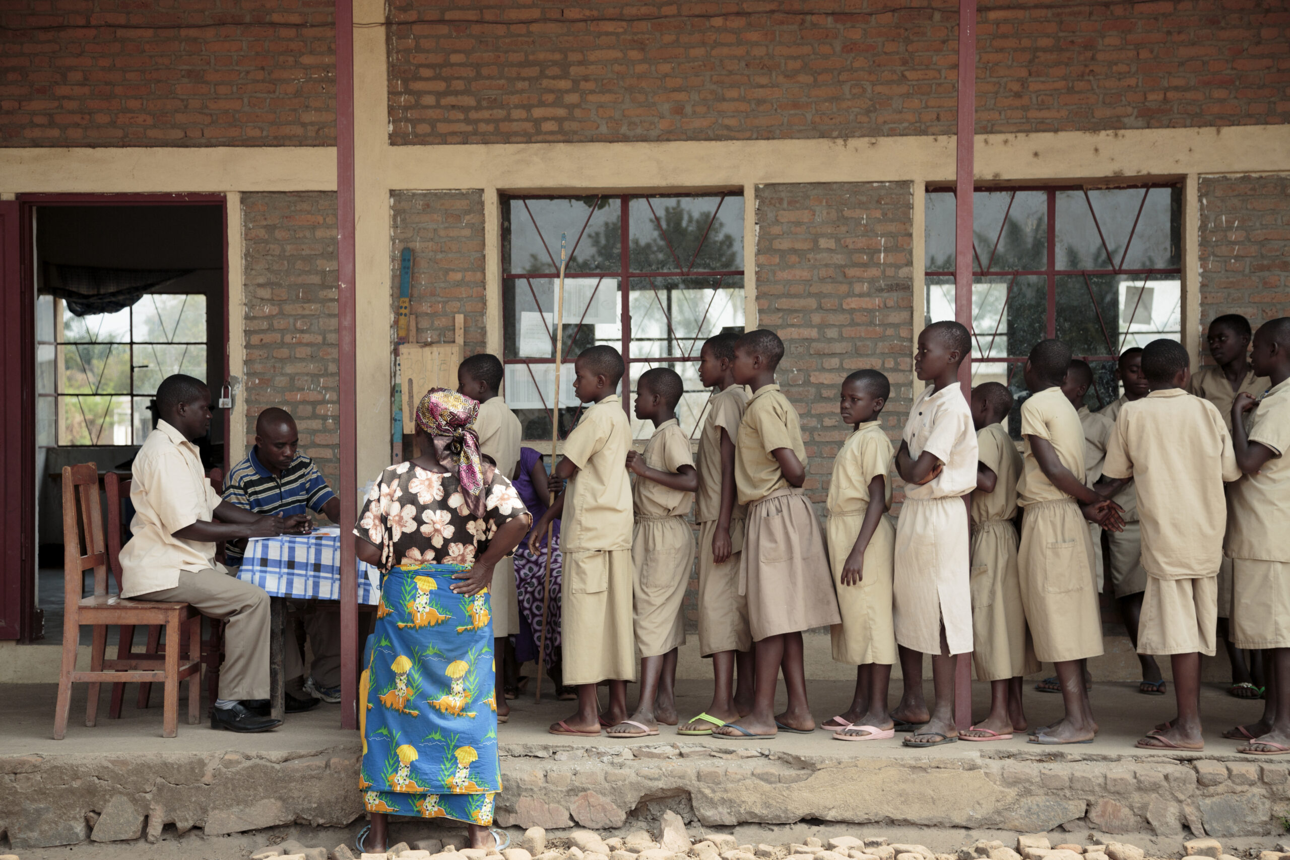 Children line up to wait for the medicine that will treat and prevent trachoma